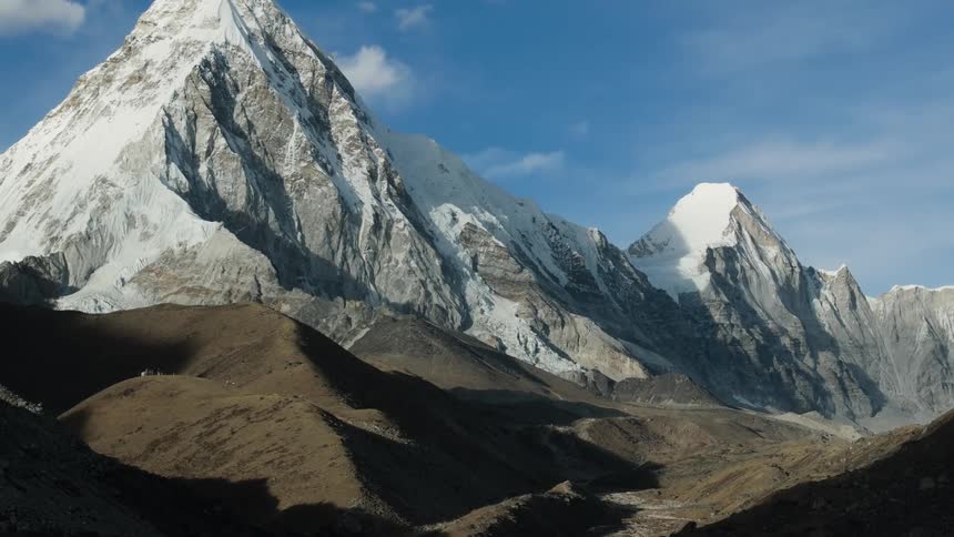 A mountain range with peaks covered in snow and ice