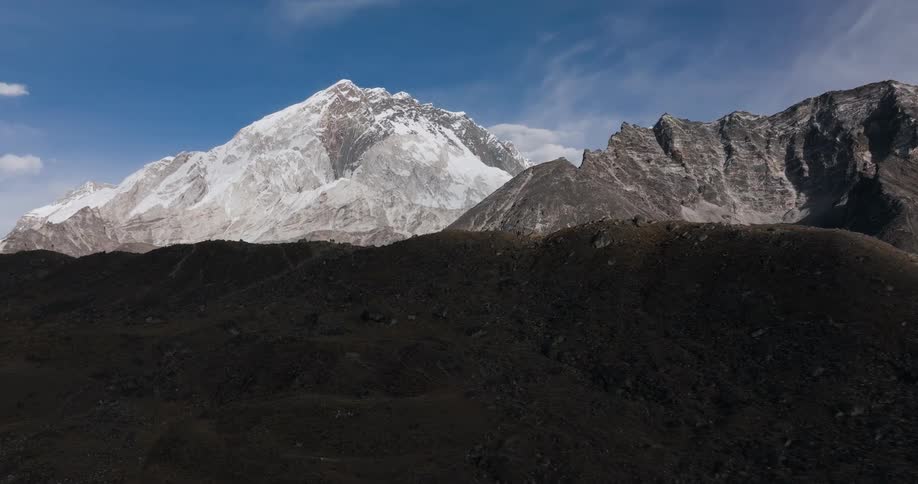 Aerial landscape of rocky and snowy mountain ranges during daytime