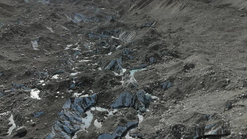 Aerial of a valley with melting snow during sunset