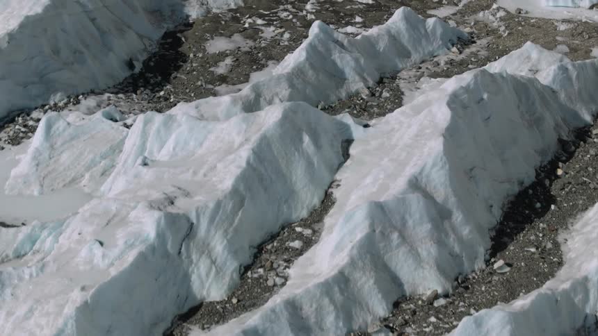 Ice rocks on rocks with snow on the ground