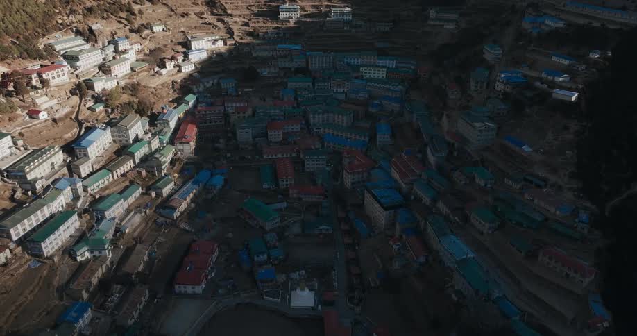 A small town with many houses built into a mountain ravine