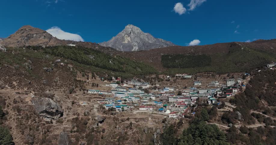Village on a rocky mountain on a blue sky day with few clouds