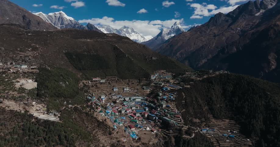 Skyline of a small village on a mountain range during the day
