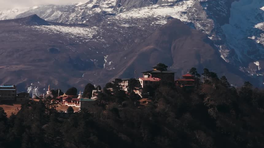 A small number of buildings sits on top of a highland