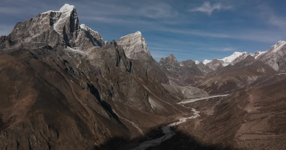 Mountain ranges with snowcapped peaks in a natural environment