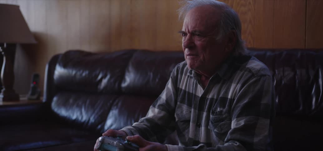 A man has fun playing video games at home