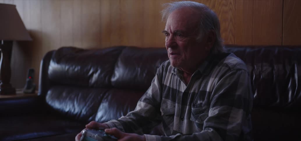 A man is using a video game controller