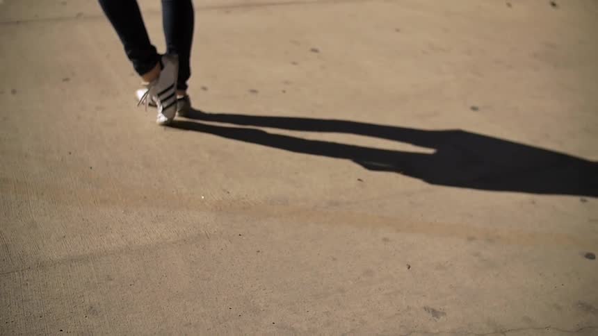 Person dancing on the pavement
