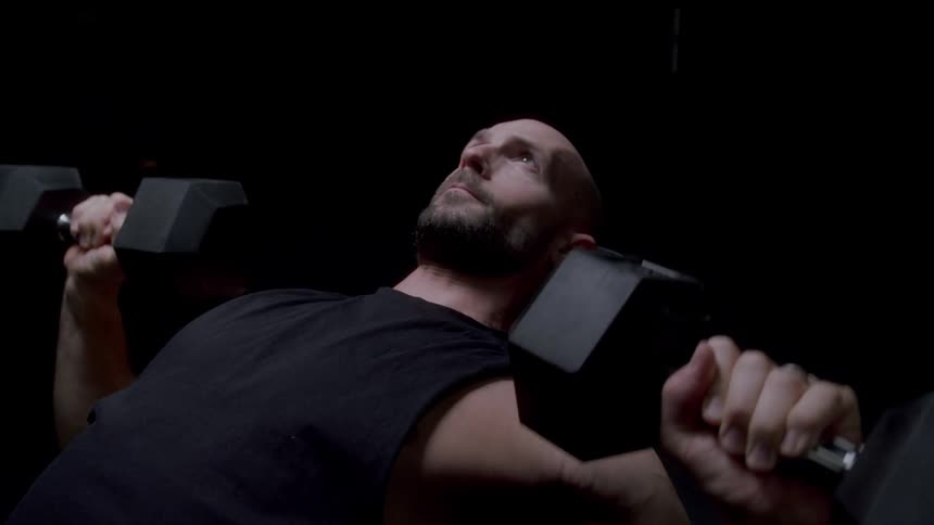 A man working out with dumbbells