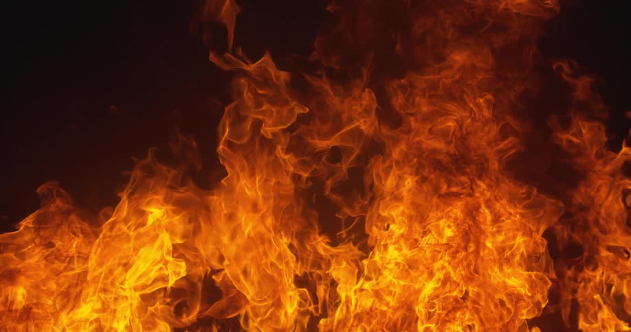 Fire rising in a dark environment in slow motion