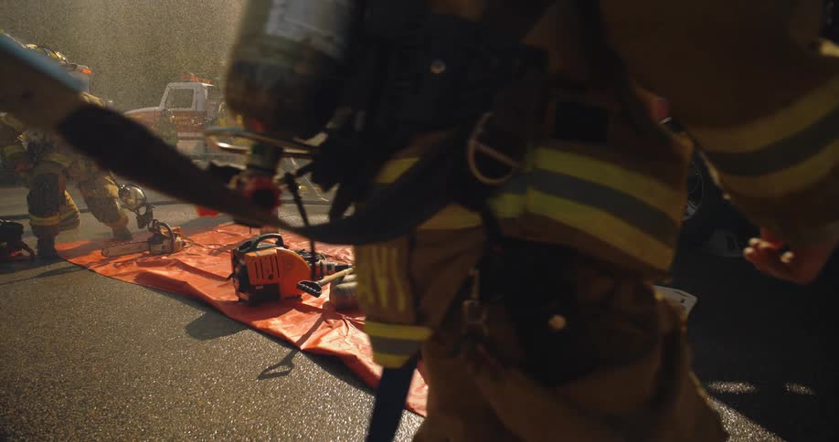 Firemen battle a fire with hoses and water