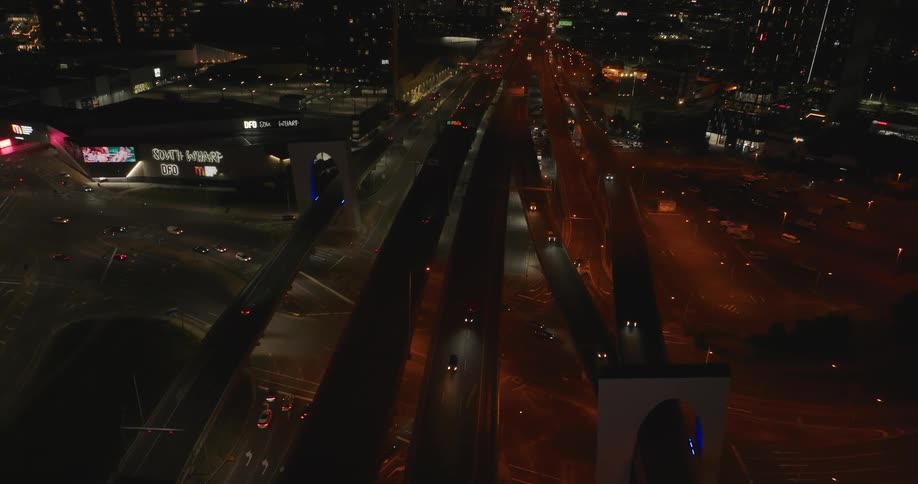 Panorama of streets and a half of a metropolis at night with vehicle traffic