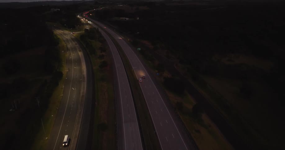 Aerial of highways in a small rural town at dusk