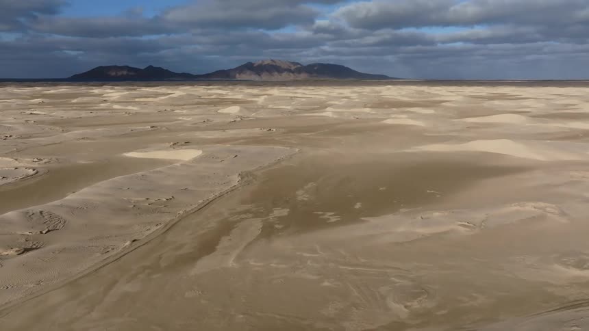 A vast desert near mountains