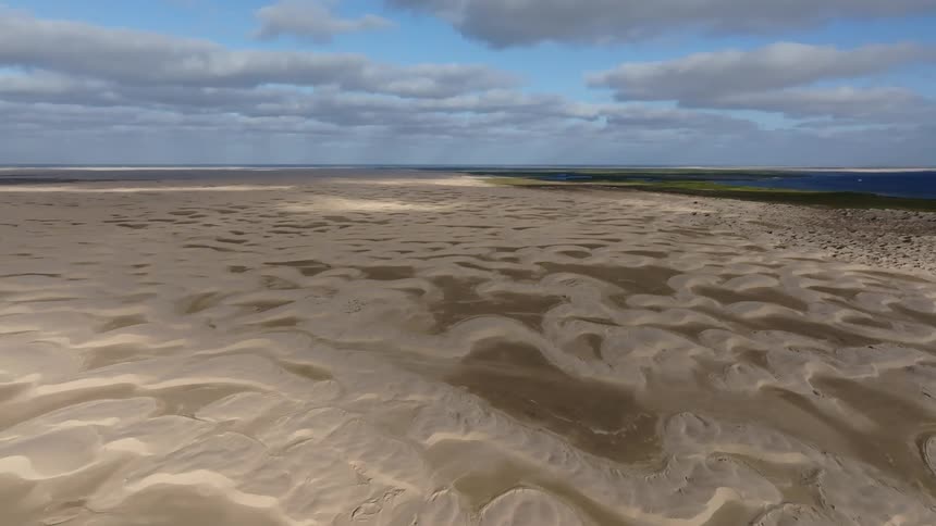 A large beach is near the ocean