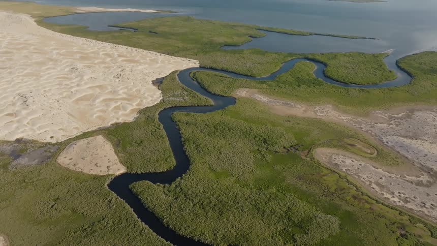 The landscape leads to water