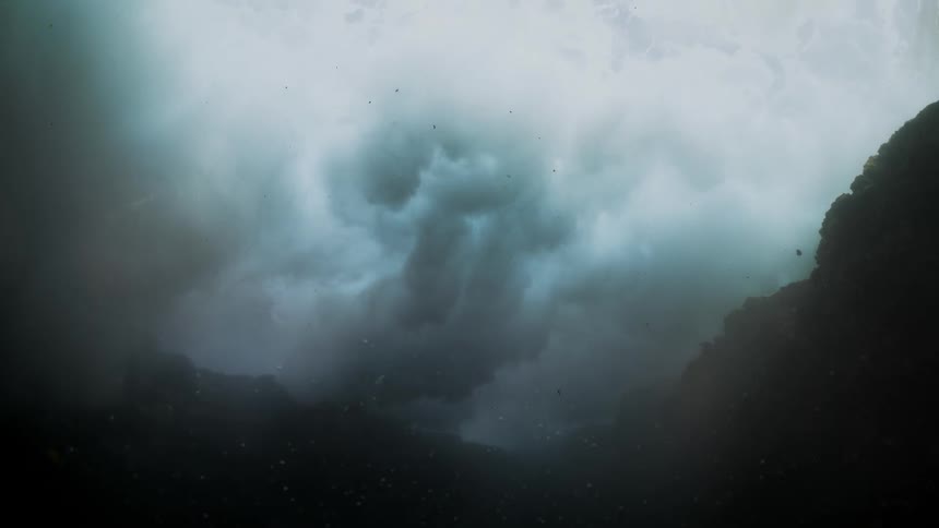 Inside the sea in a house overlooking a wave remembering and generating foam