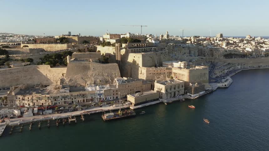 Ancient city by the sea on a cloudless blue sky day