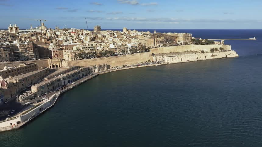 Skyline of a coastal city on a sunny day