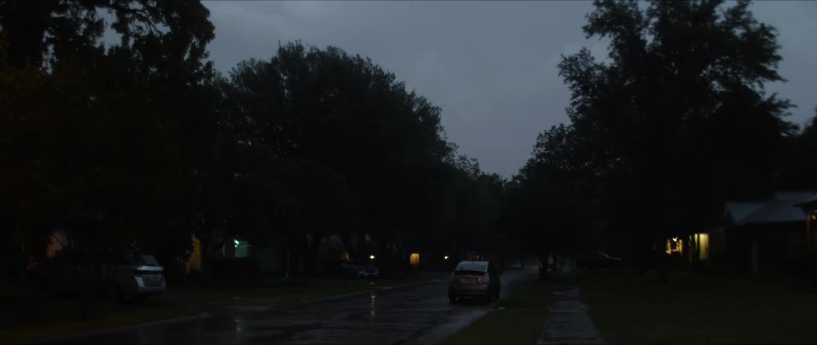 A shot of a wet street at sunset