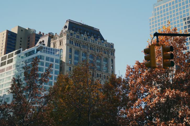 View of commercial buildings in a metropolis on a cloudless blue sky day