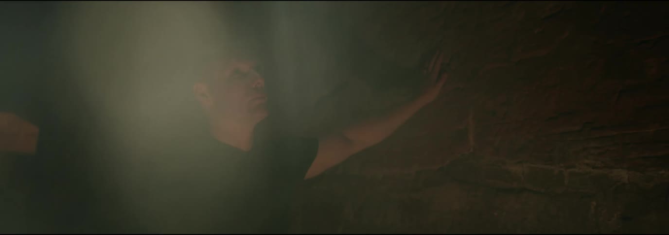 Portrait of a young man inside a cave analyzing