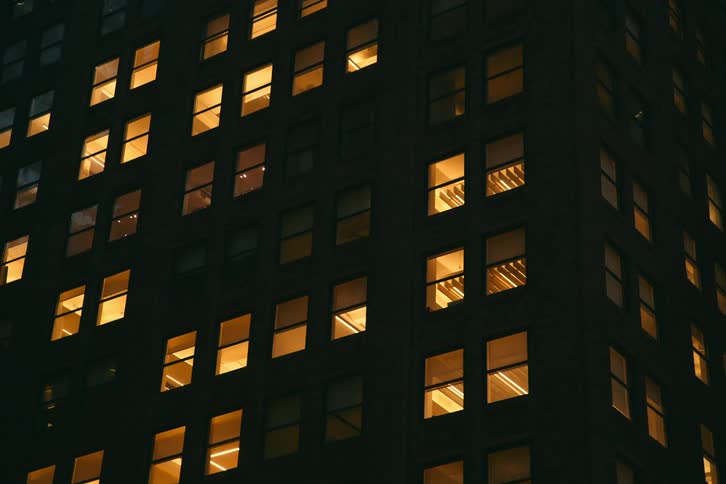 View of a building with lights on at night