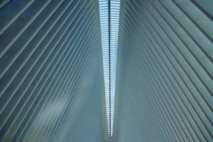 A view of a building with sunlight above it