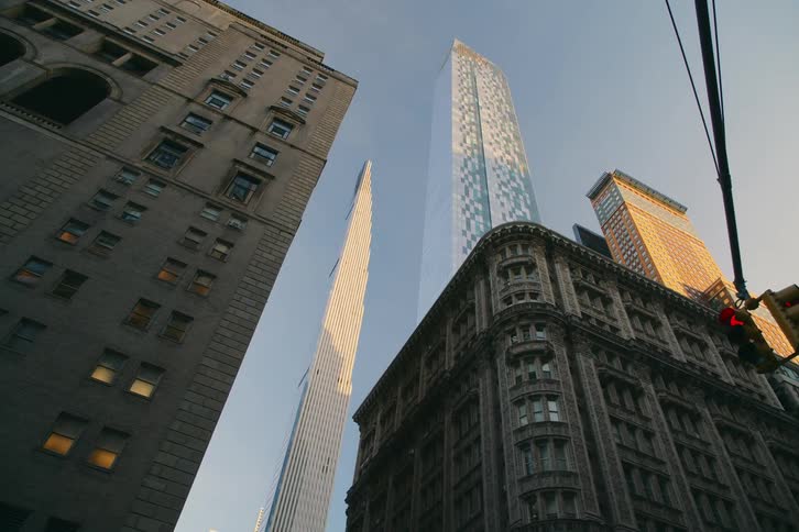 Upward view of skyscrapers in a metropolis on a cloudless day