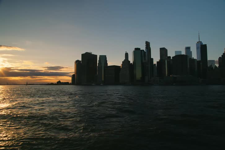 The skyline of new york city at sunset