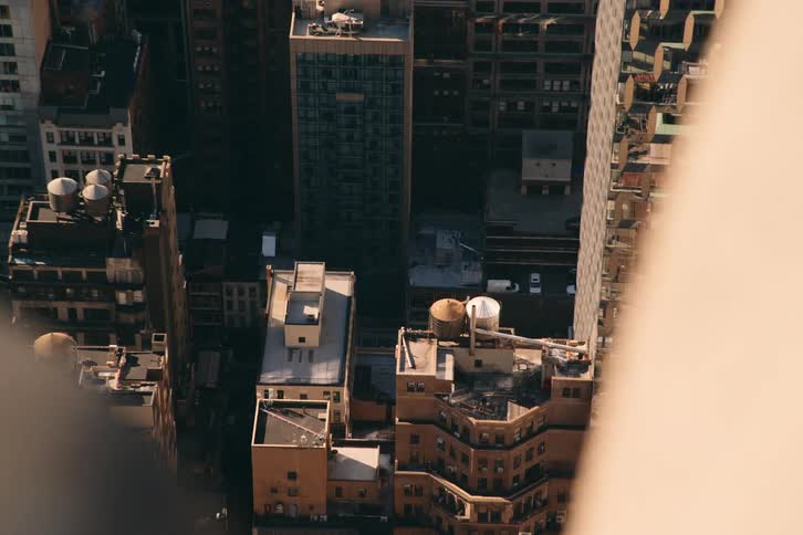 City buildings with giant water tanks on the roof