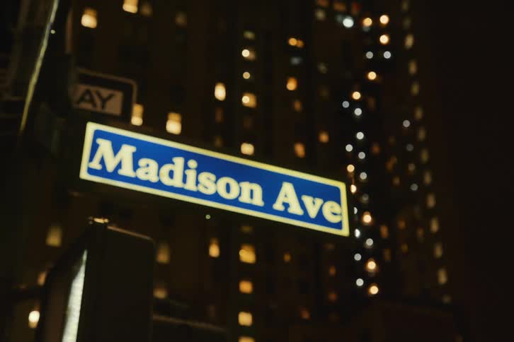 Metropolis streets name on a pole at night