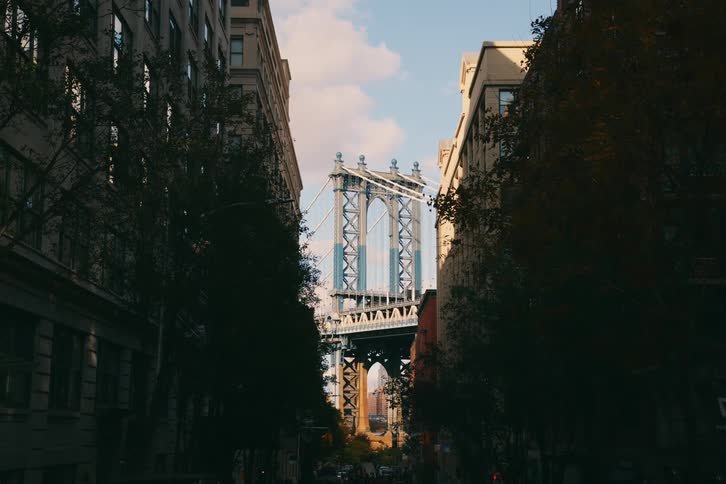 A new york city street overlooking a bridge