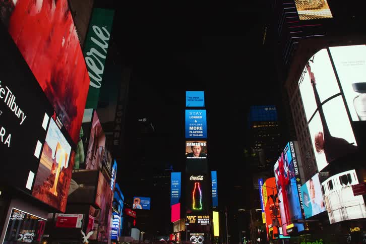 Panorama of advertising billboards at night on buildings in new york