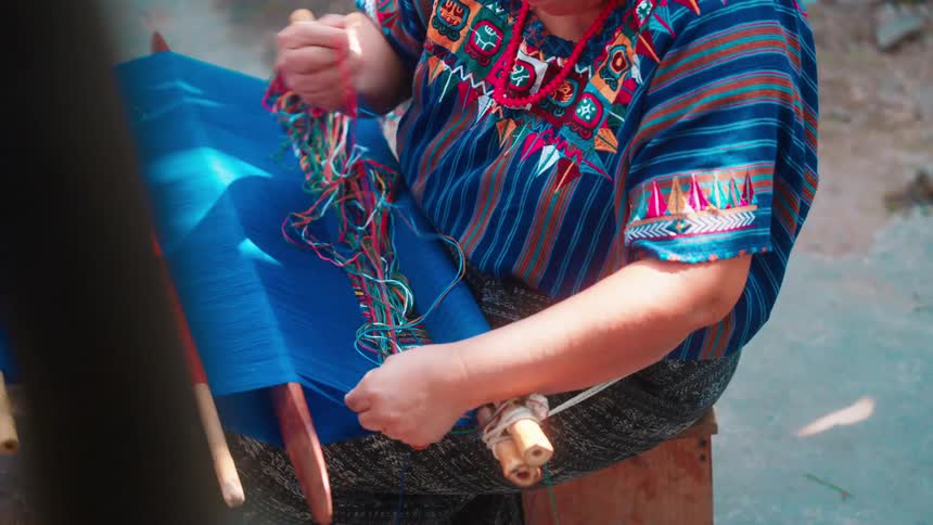 Womans hands manually lowering a cloth