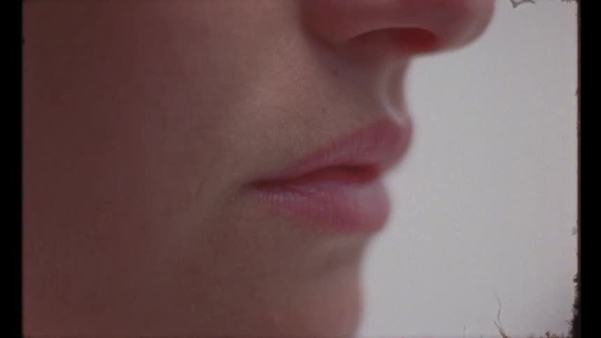 Close up a woman stretching her lips and mouth