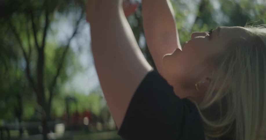 A woman playing with her baby in a public park
