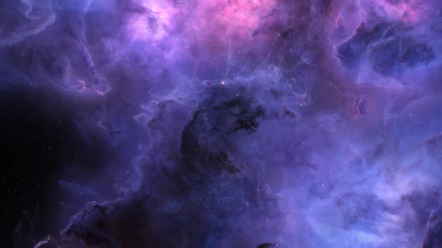 A colorful nebula filled with bright purple and blue hues in space