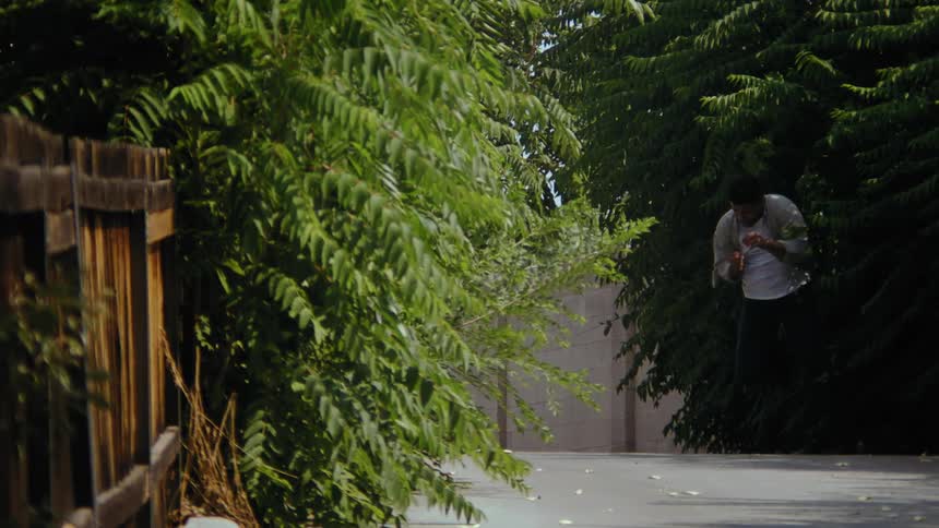 Man running during the day with desperate expression