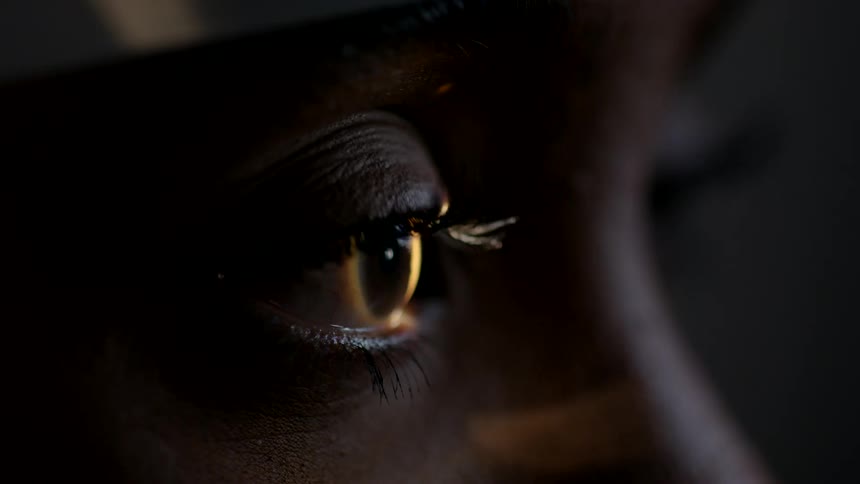 A light is being shined in a womans eye