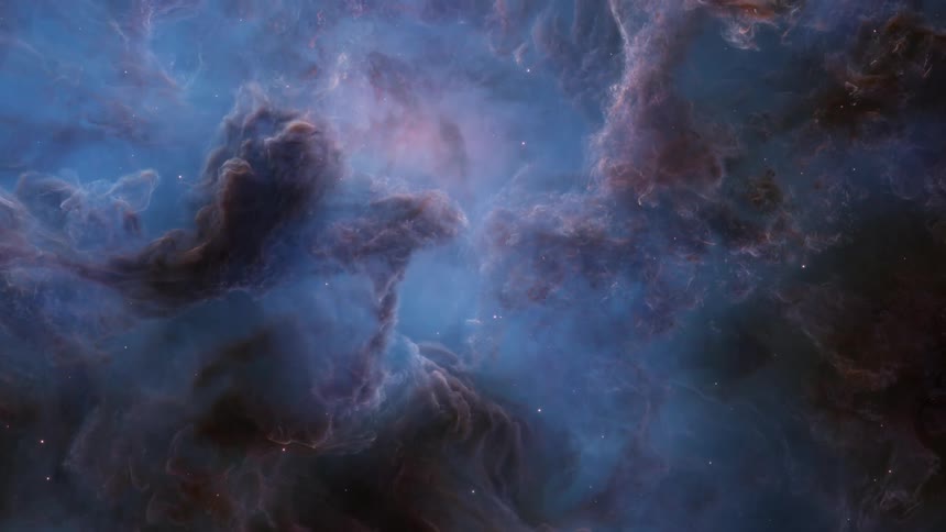 Light glows at center of blue and brown gaseous mass as bright spots float past