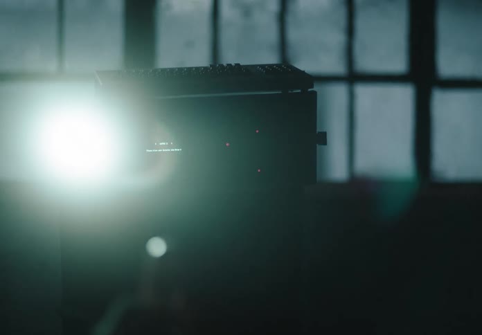 A projector is running in the dark