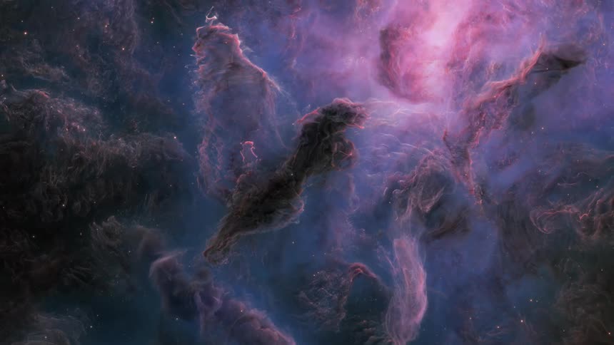 A colorful nebula filled with bright purple and blue hues in space