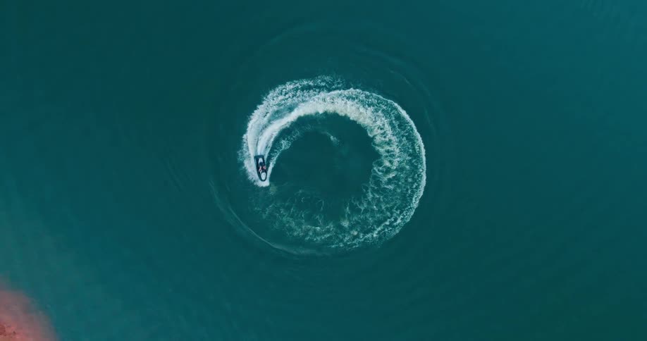 A jet ski is driving in circles