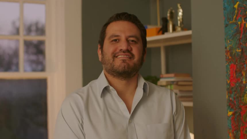 Portrait of a man raising his head and smiling