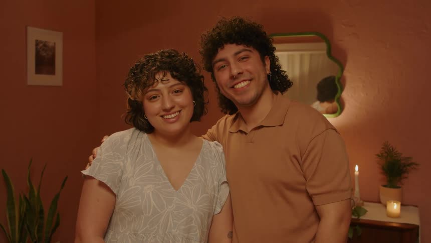 A couple of lovers hugging in the living room