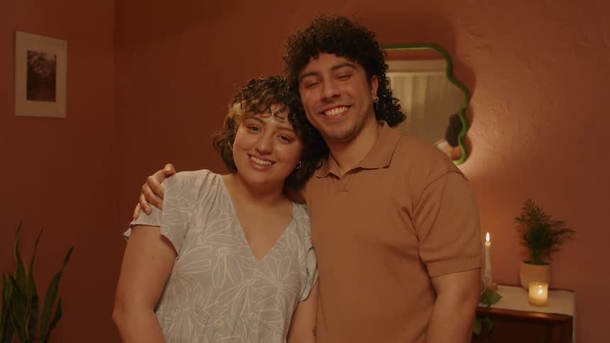 Portrait of a couple standing holding each other affectionately