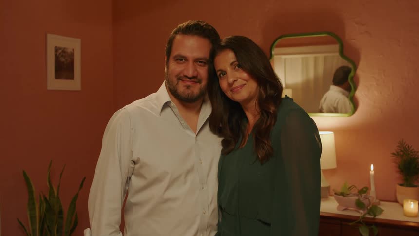 A man and woman posing for a portrait together