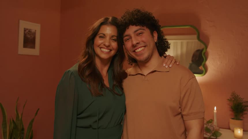 A mom and her son smiling together