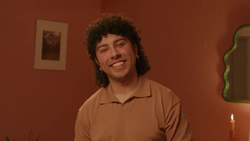 A clip of an hispanic man smiling
